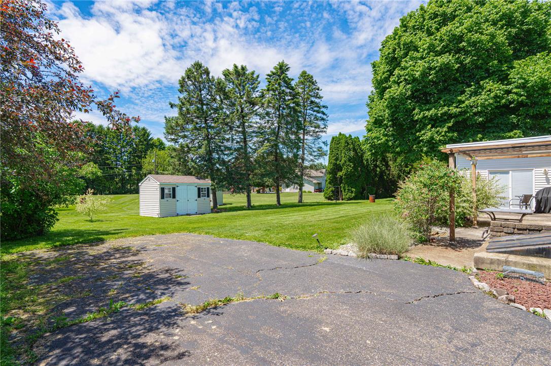 579 Cherry Road Northampton, PA 18067 - Photo 46 of 57 A secluded backyard oasis with ample green space and a handy storage shed awaits. Additional parking and handicap entry is available.