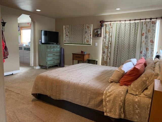 22810 Nelson Road Bend, OR 97701 - Photo 8 of 43 a bedroom with a bed and a television