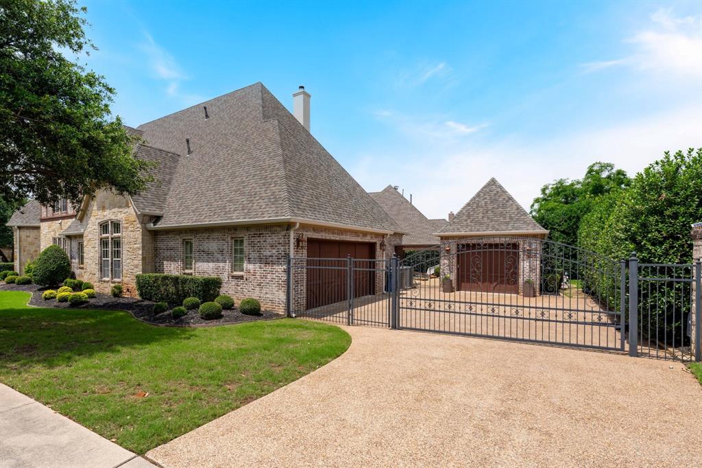 2101 Vail Road Southlake, TX 76092 - Photo 39 of 40 a front view of a house with a yard