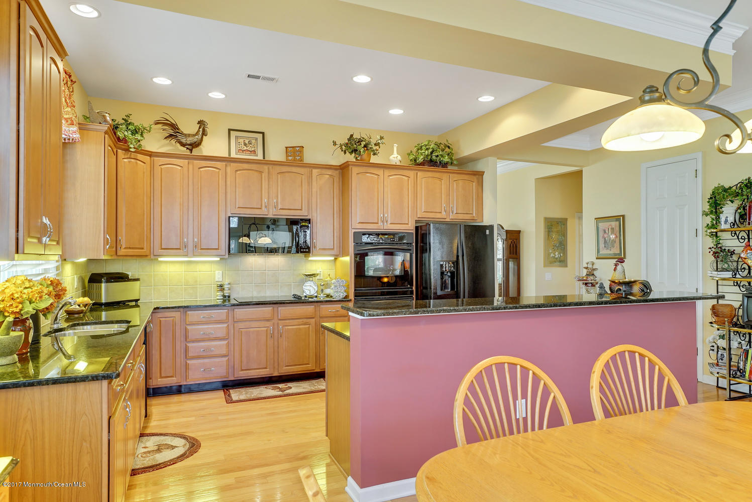 88 Crooked Stick Road Jackson, NJ 08527 - Photo 24 of 41 a kitchen with stainless steel appliances granite countertop a sink and a refrigerator