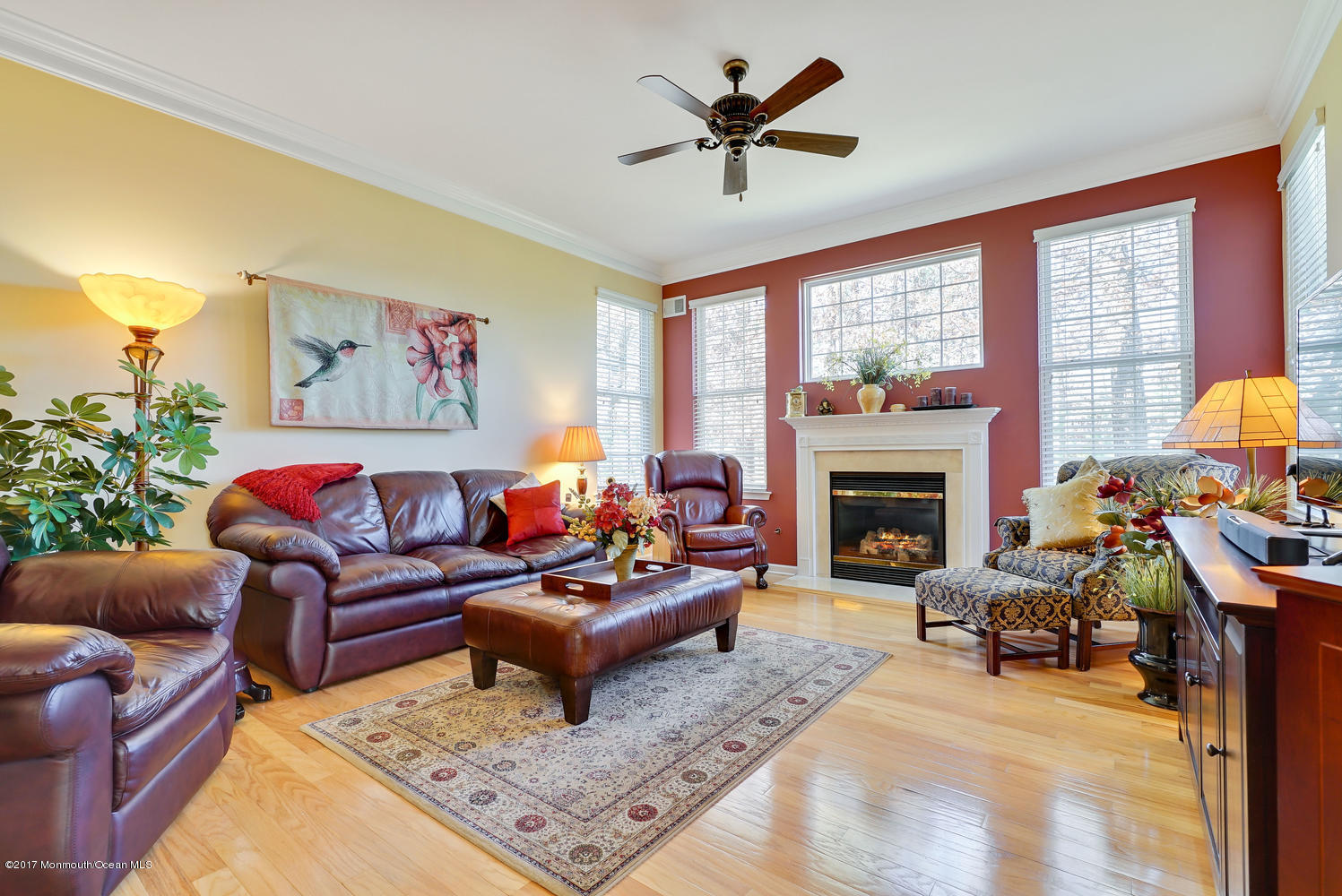 88 Crooked Stick Road Jackson, NJ 08527 - Photo 30 of 41 a living room with furniture a large window and a fireplace
