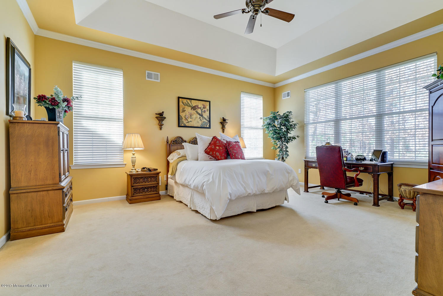 88 Crooked Stick Road Jackson, NJ 08527 - Photo 33 of 41 a bedroom with a bed and a chandelier