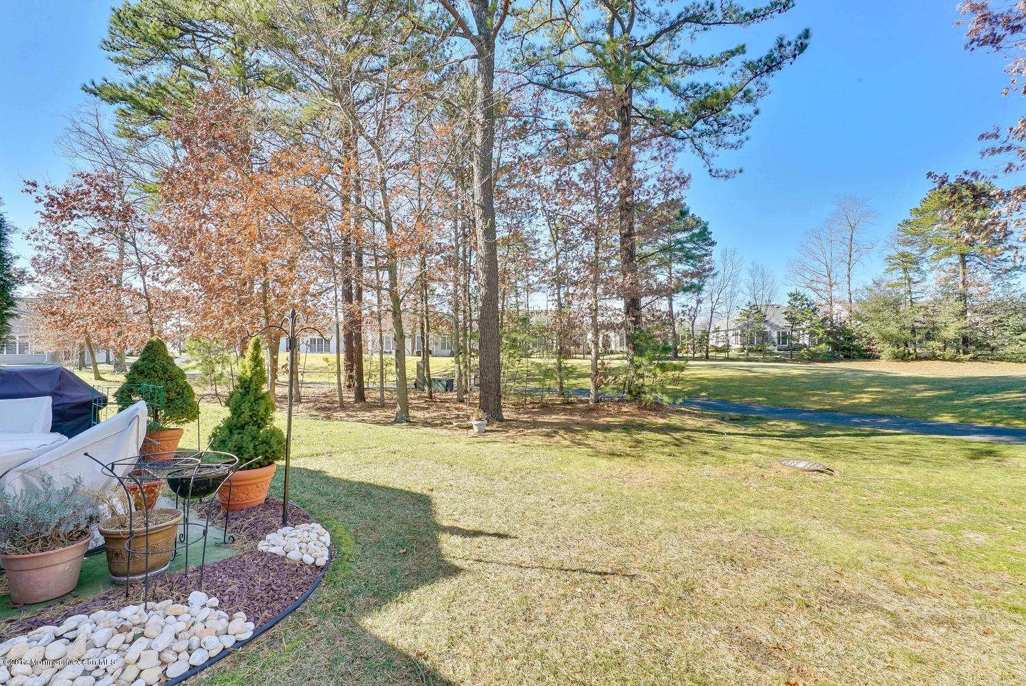 88 Crooked Stick Road Jackson, NJ 08527 - Photo 39 of 41 a view of a swimming pool with a patio