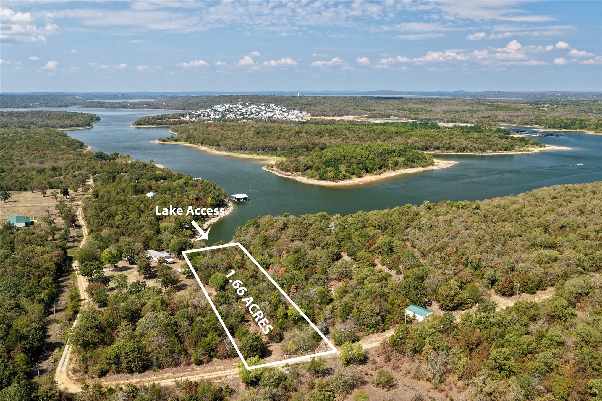 4 Dozer Mountain Road Eufaula, OK 74432 - Photo 1 of 19 1.66-acre lot featuring wooded terrain with lake access. Carlton Landing is what's in the background.