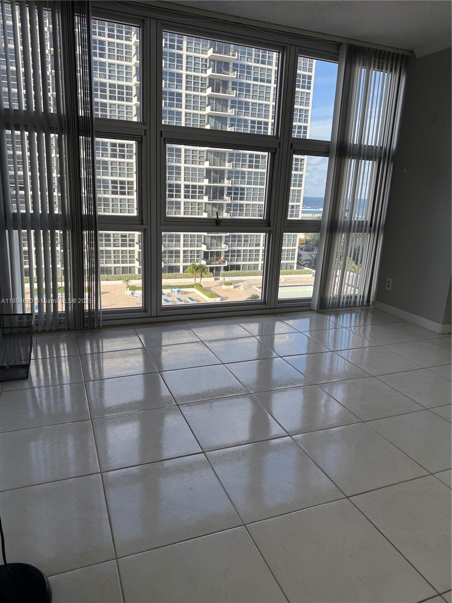 525 North Ocean Boulevard, Unit 920 Pompano Beach, FL 33062 - Photo 19 of 38 a view of an empty room and window