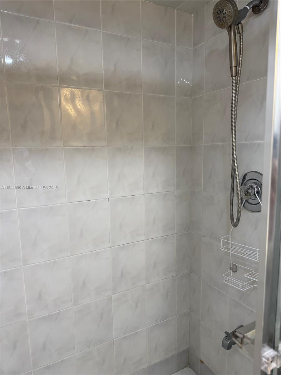 525 North Ocean Boulevard, Unit 920 Pompano Beach, FL 33062 - Photo 23 of 38 a bathroom with a shower