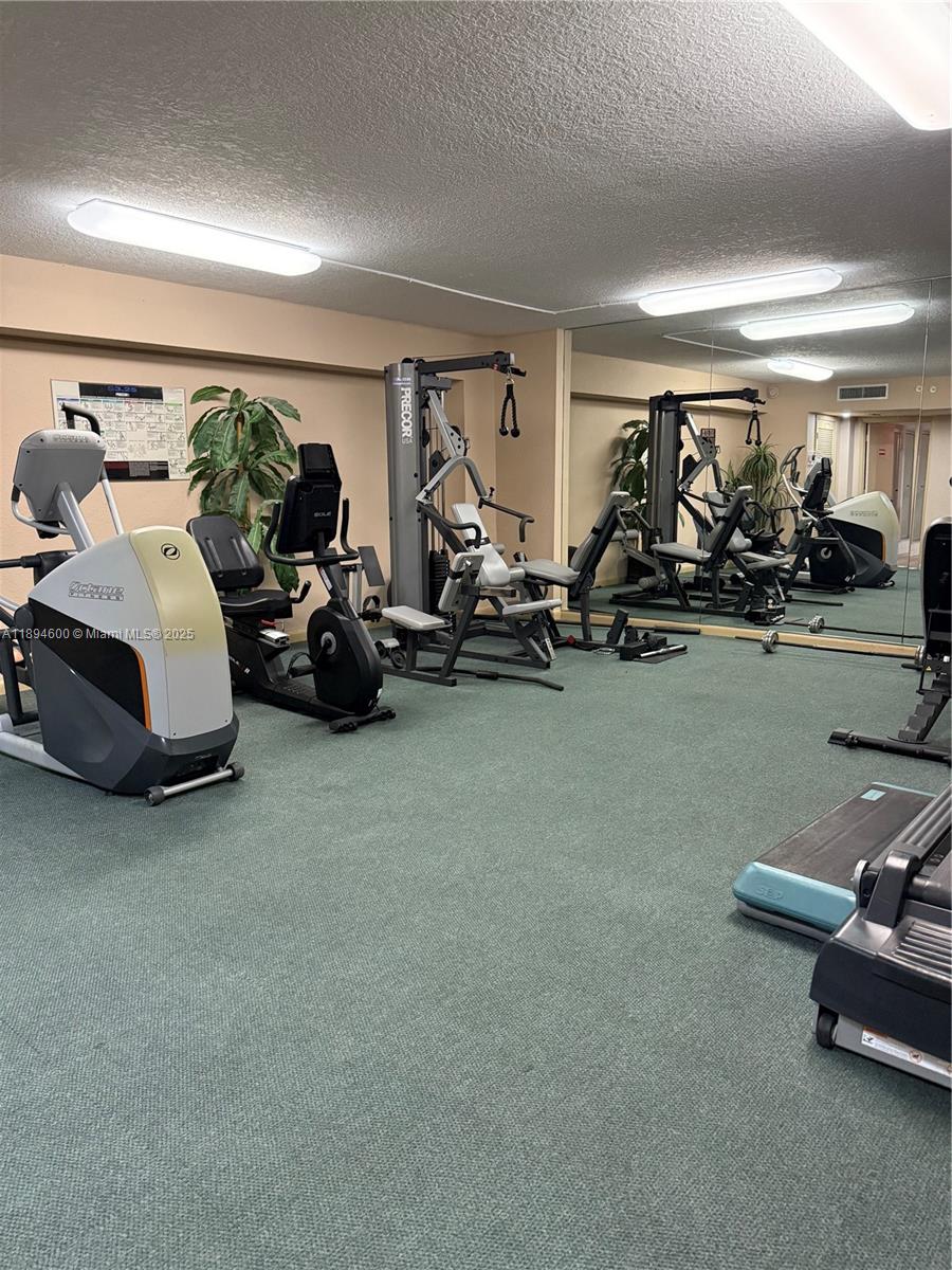 525 North Ocean Boulevard, Unit 920 Pompano Beach, FL 33062 - Photo 33 of 38 a view of a room with gym equipment