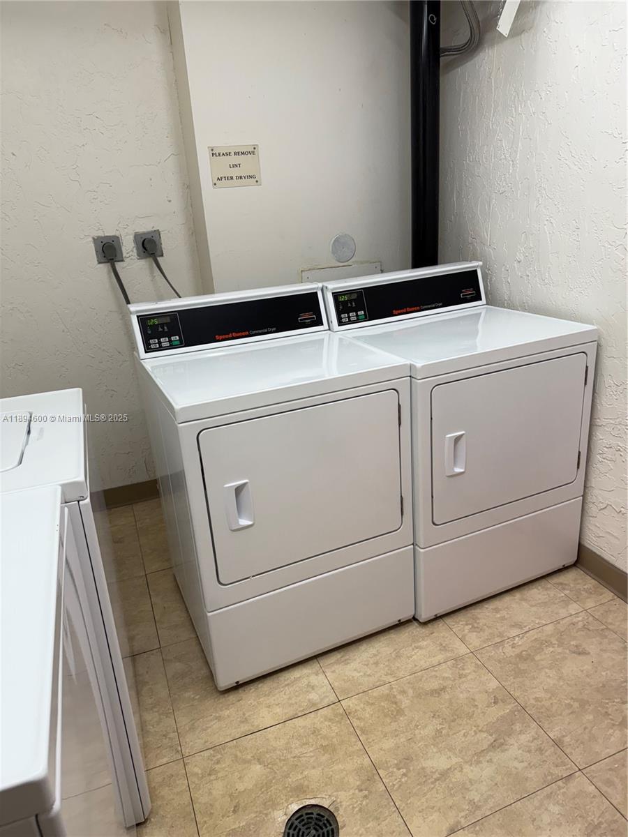 525 North Ocean Boulevard, Unit 920 Pompano Beach, FL 33062 - Photo 34 of 38 a utility room with dryer and washer