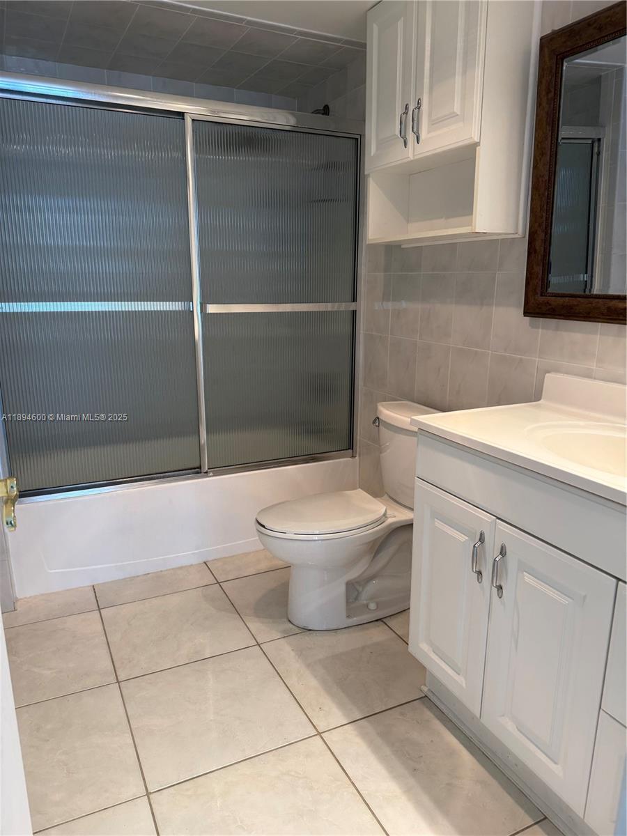 525 North Ocean Boulevard, Unit 920 Pompano Beach, FL 33062 - Photo 38 of 38 a bathroom with a toilet and a sink