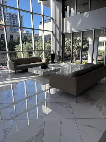 a view of a patio with a table and chairs