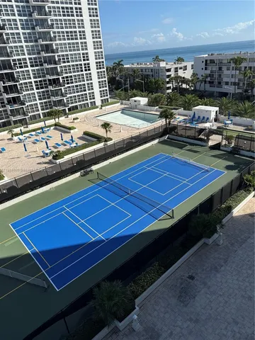 a view of a pool with outdoor seating