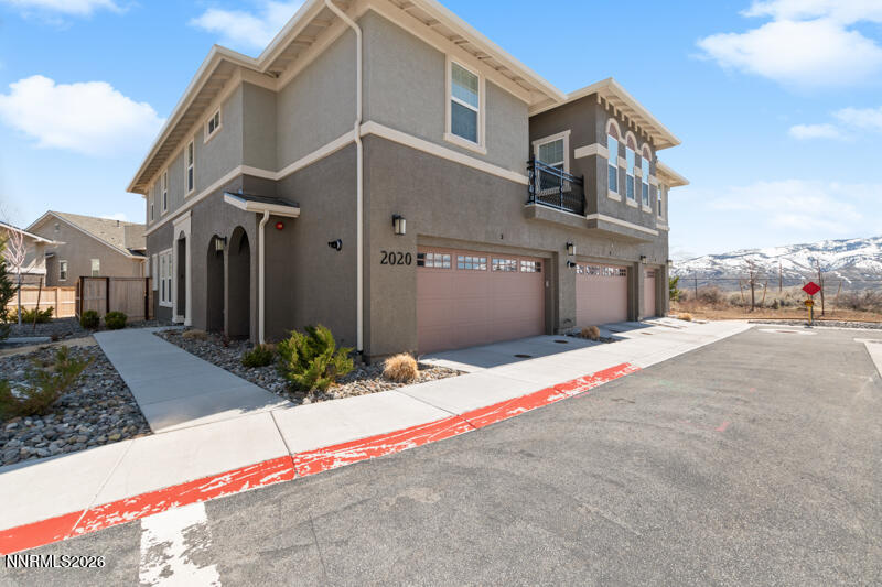 2020 Cradle Mountain Drive, Unit 3 Reno, NV 89523 - Photo 1 of 29 a front view of a house with a yard