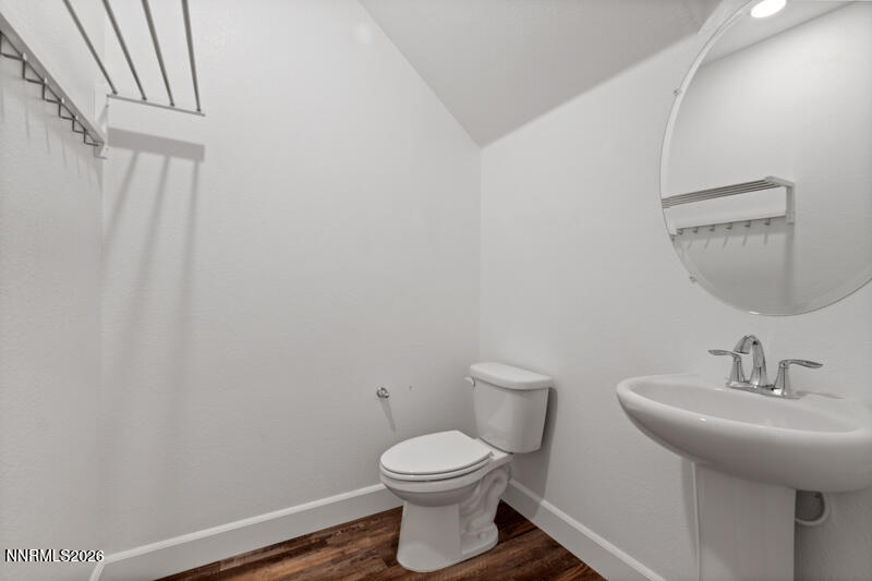 2020 Cradle Mountain Drive, Unit 3 Reno, NV 89523 - Photo 17 of 29 a bathroom with a sink a toilet and a mirror