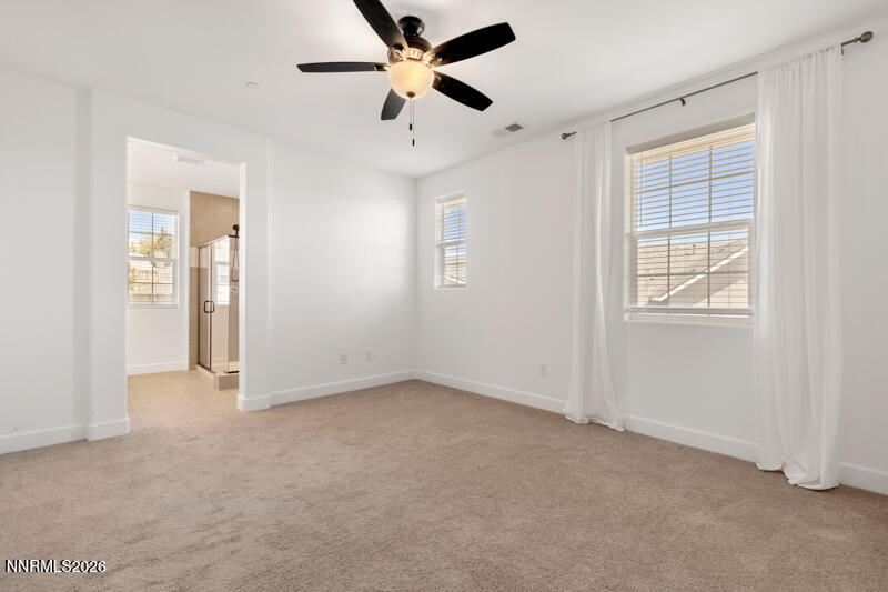 2020 Cradle Mountain Drive, Unit 3 Reno, NV 89523 - Photo 18 of 29 an empty room with closet and windows