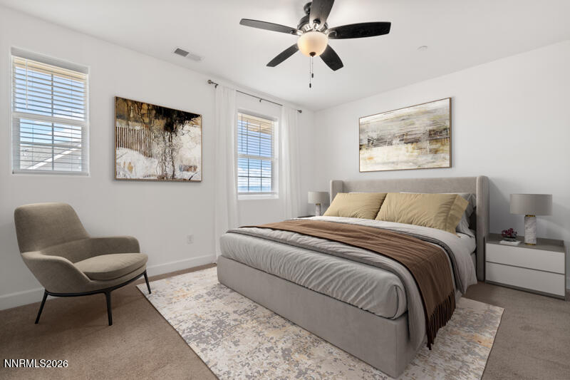 2020 Cradle Mountain Drive, Unit 3 Reno, NV 89523 - Photo 21 of 29 a bedroom with a bed and a chair
