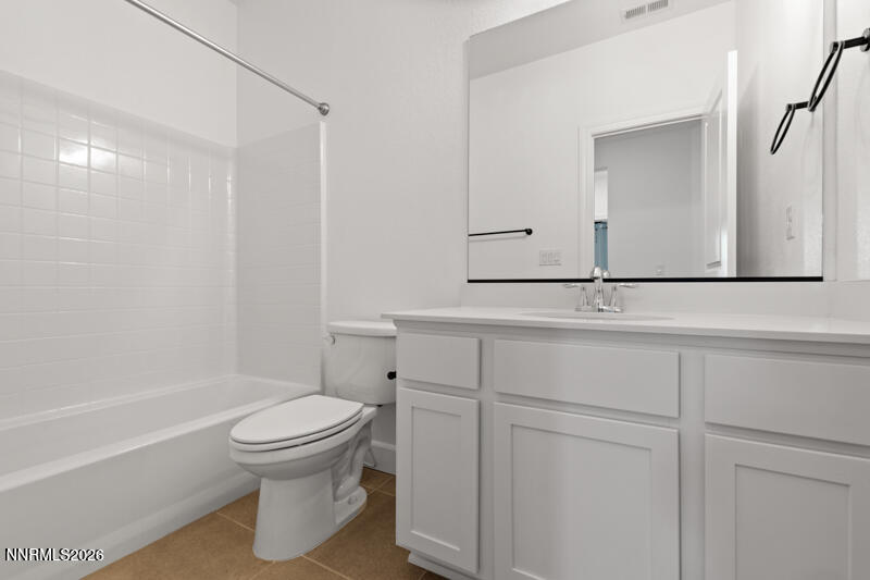2020 Cradle Mountain Drive, Unit 3 Reno, NV 89523 - Photo 25 of 29 a bathroom with a sink a toilet and shower