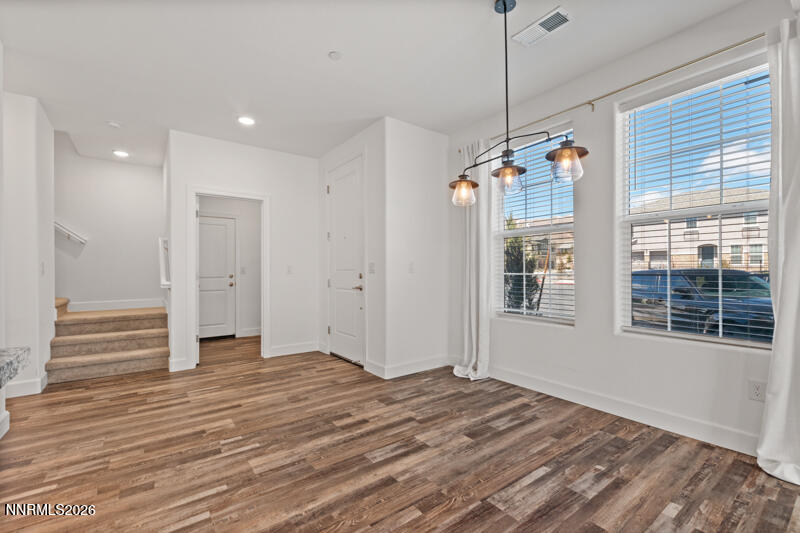 2020 Cradle Mountain Drive, Unit 3 Reno, NV 89523 - Photo 3 of 29 a view of a room with wooden floor and windows