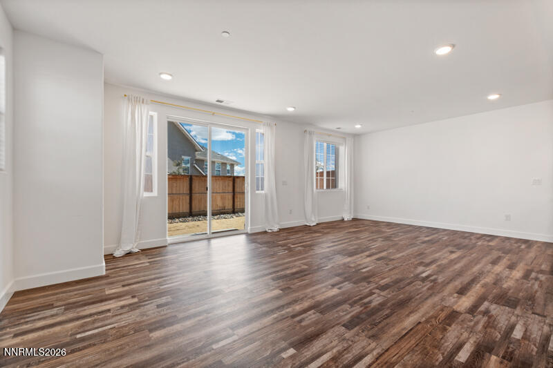2020 Cradle Mountain Drive, Unit 3 Reno, NV 89523 - Photo 6 of 29 a view of an empty room with wooden floor and a window