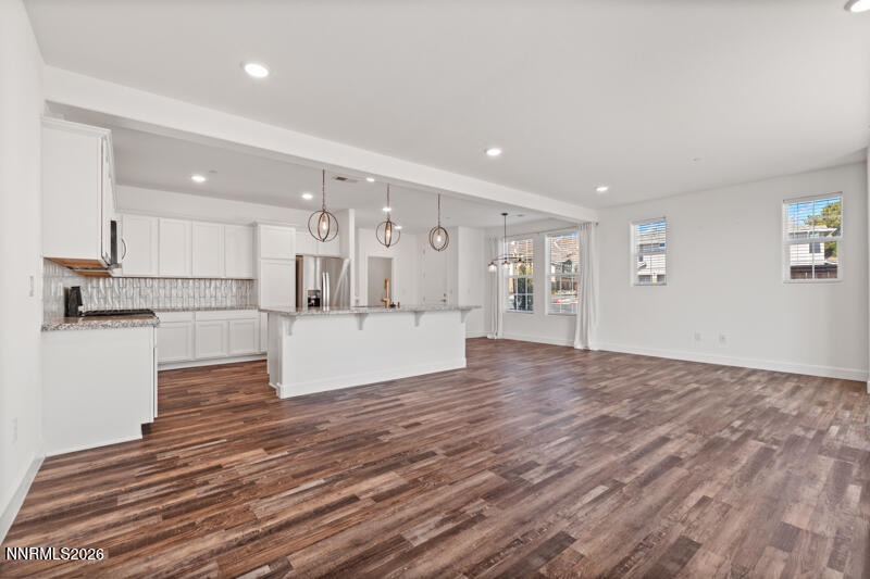 2020 Cradle Mountain Drive, Unit 3 Reno, NV 89523 - Photo 9 of 29 a view of a kitchen with wooden floor and a kitchen