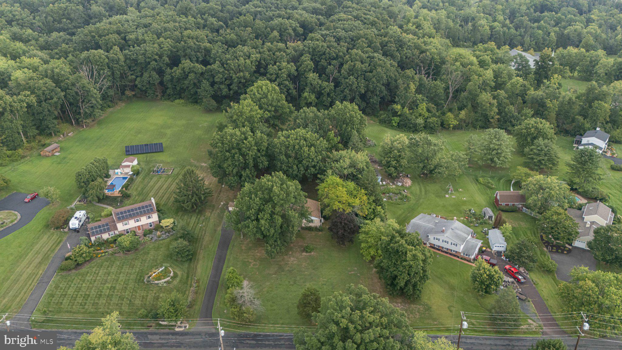 130 Webber Road Telford, PA 18969 - Photo 51 of 52 Lush greenery surrounds serene homes.