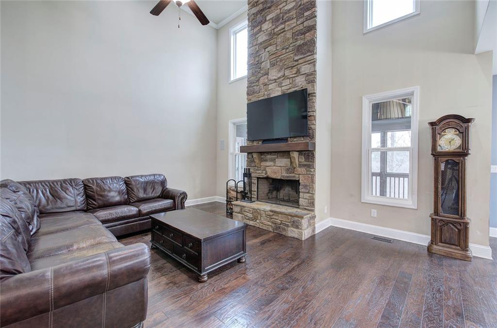 18 Weather View Trail Cartersville, GA 30121 - Photo 18 of 78 a living room with furniture a flat screen tv and a fireplace