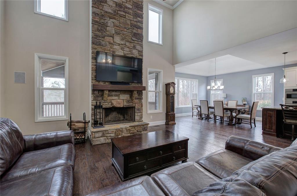 18 Weather View Trail Cartersville, GA 30121 - Photo 20 of 78 a living room with furniture a flat screen tv and a fireplace