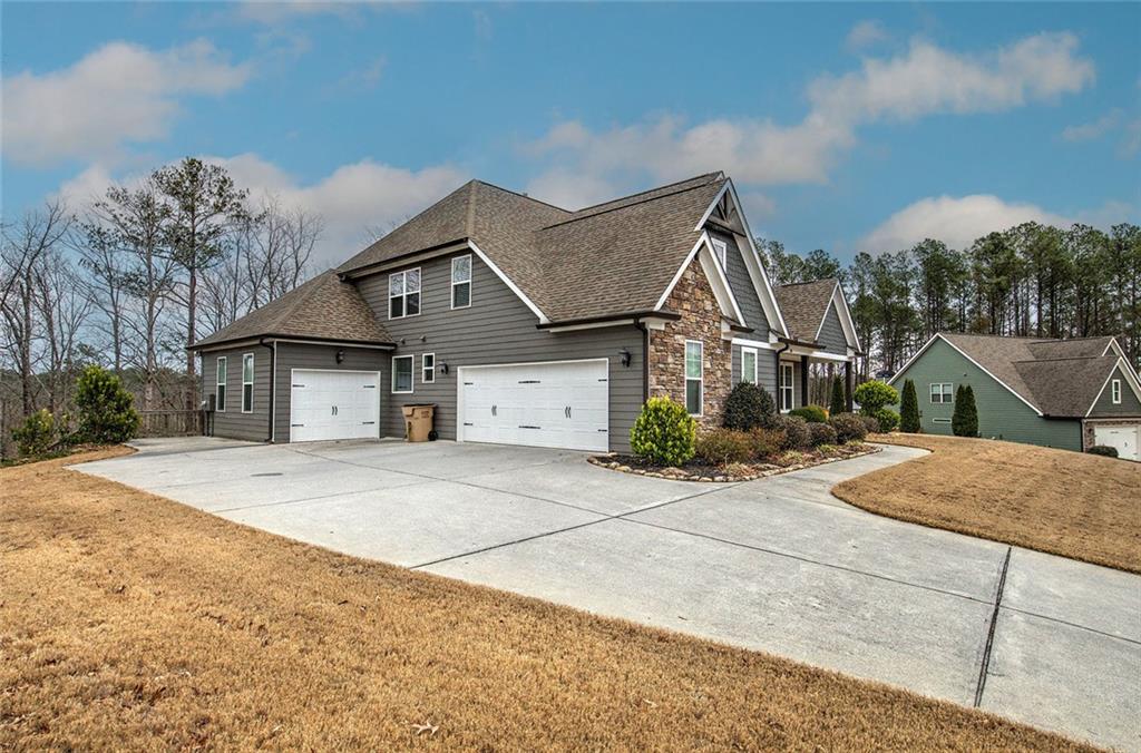 18 Weather View Trail Cartersville, GA 30121 - Photo 2 of 78 a front view of a house with a yard and garage