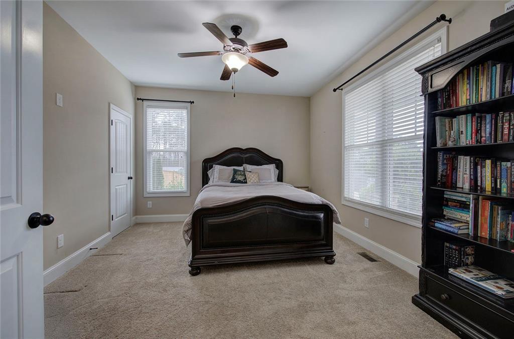 18 Weather View Trail Cartersville, GA 30121 - Photo 23 of 78 a bedroom with a bed and a book shelf