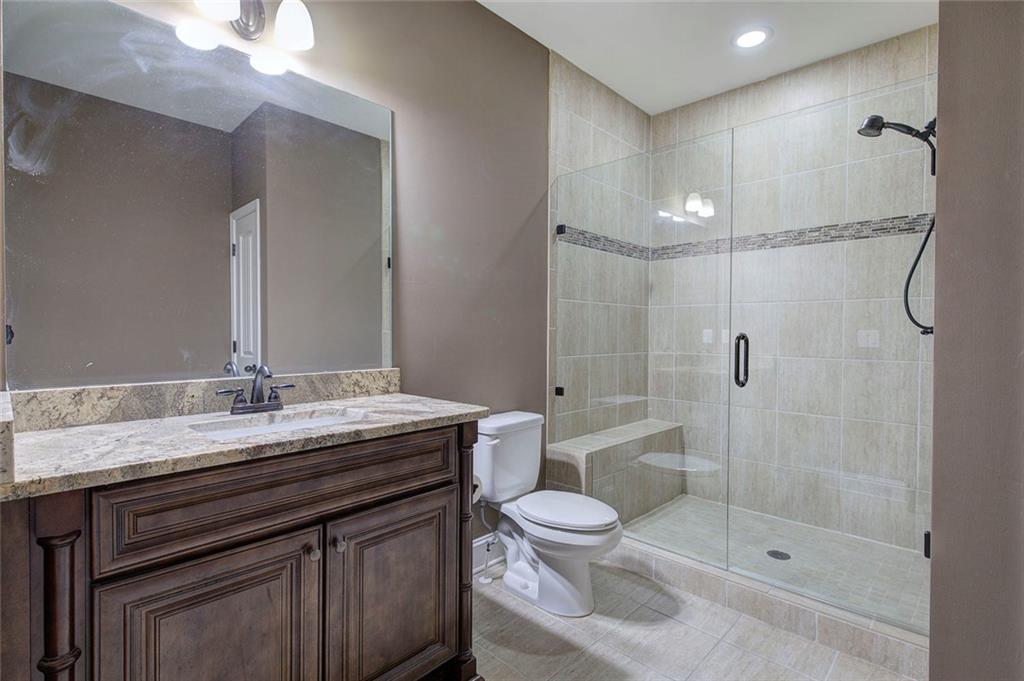 18 Weather View Trail Cartersville, GA 30121 - Photo 26 of 78 a bathroom with a granite countertop sink toilet and shower