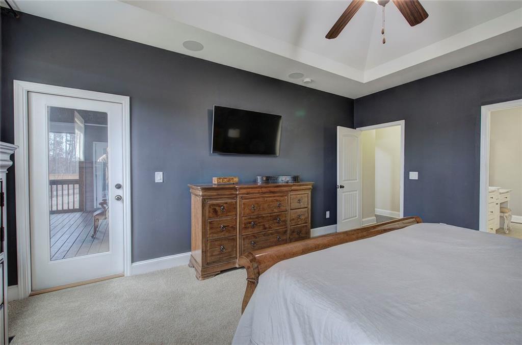 18 Weather View Trail Cartersville, GA 30121 - Photo 28 of 78 a bedroom with a bed and a flat screen tv