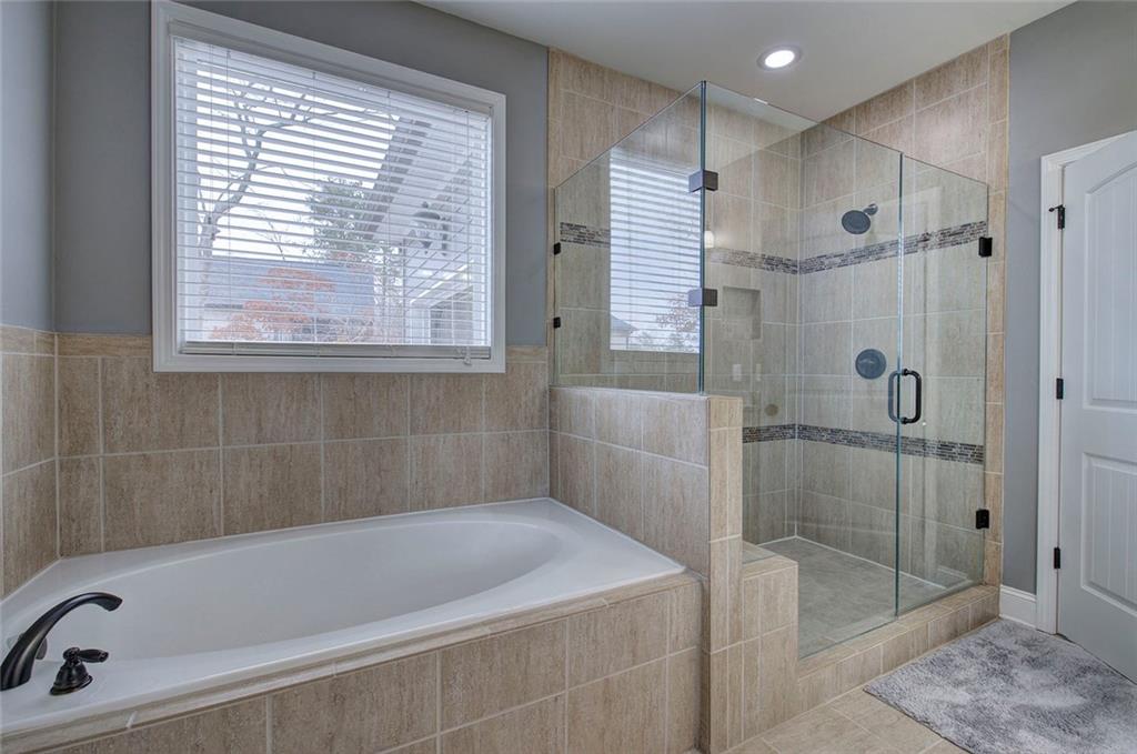 18 Weather View Trail Cartersville, GA 30121 - Photo 31 of 78 a bath tub sitting next to a bathroom sink