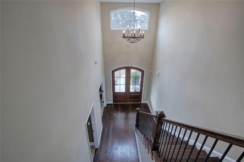 18 Weather View Trail Cartersville, GA 30121 - Photo 33 of 78 a view of a hallway with wooden floor and a chandelier