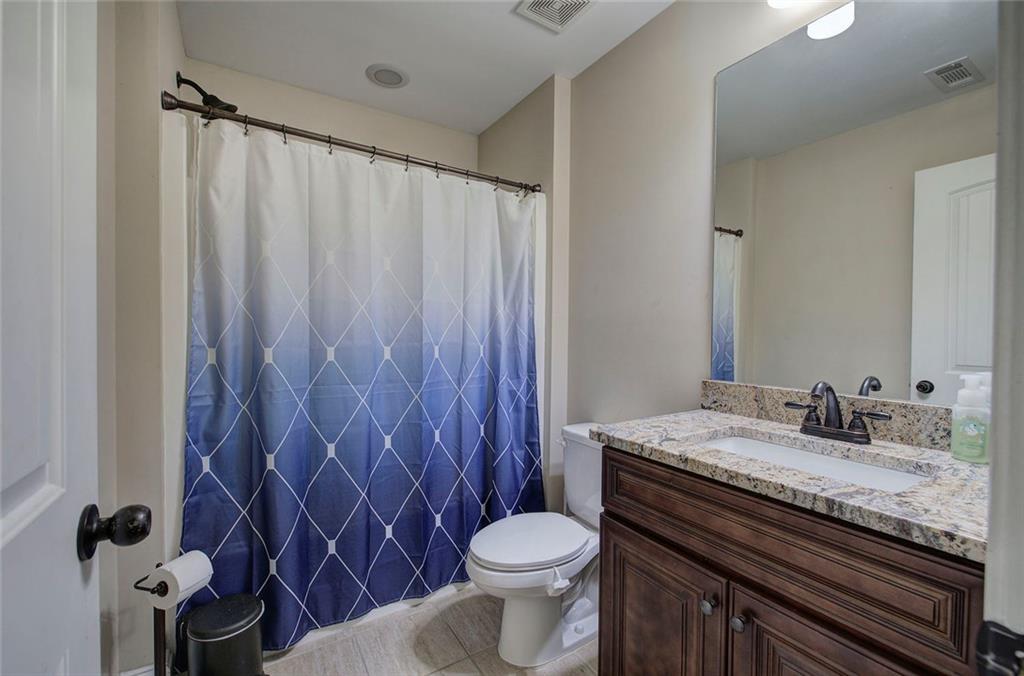18 Weather View Trail Cartersville, GA 30121 - Photo 37 of 78 a bathroom with a granite countertop toilet and a sink