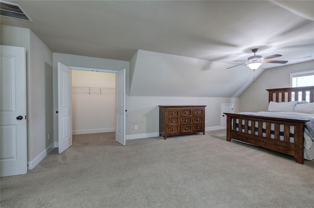 18 Weather View Trail Cartersville, GA 30121 - Photo 40 of 78 an empty room with windows and ceiling fan