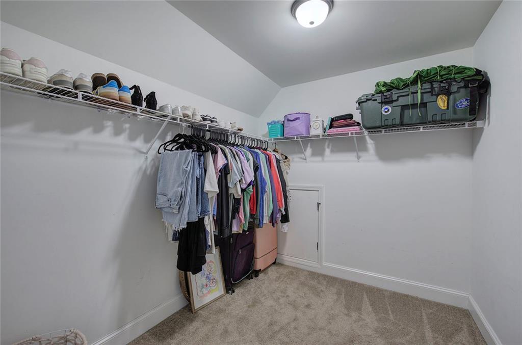 18 Weather View Trail Cartersville, GA 30121 - Photo 44 of 78 a view of walk in closet with clothes and shoes