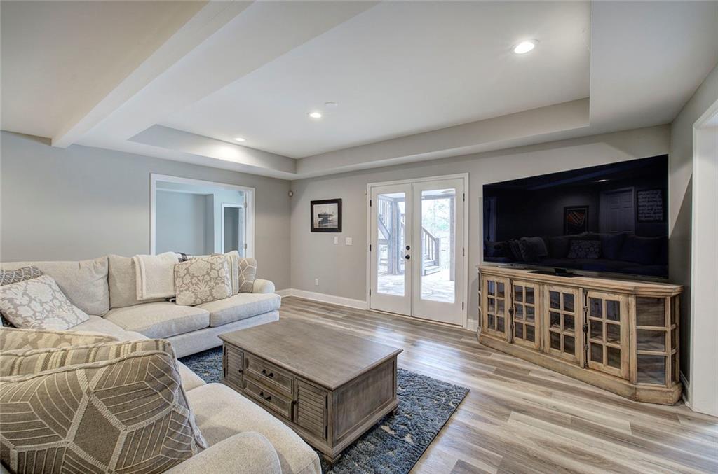 18 Weather View Trail Cartersville, GA 30121 - Photo 45 of 78 a living room with furniture and a flat screen tv