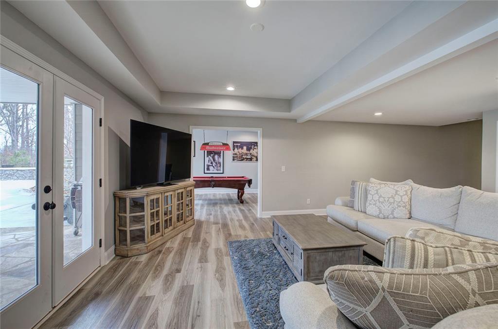 18 Weather View Trail Cartersville, GA 30121 - Photo 48 of 78 a living room with furniture and a flat screen tv