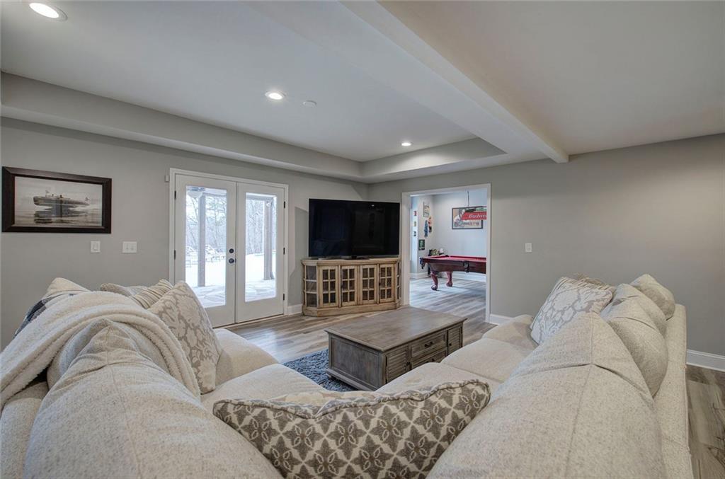 18 Weather View Trail Cartersville, GA 30121 - Photo 49 of 78 a living room with furniture and a flat screen tv