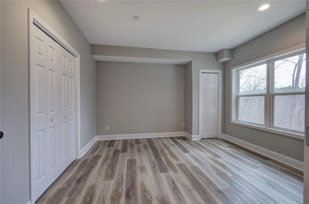 18 Weather View Trail Cartersville, GA 30121 - Photo 51 of 78 wooden floor in an empty room with a window
