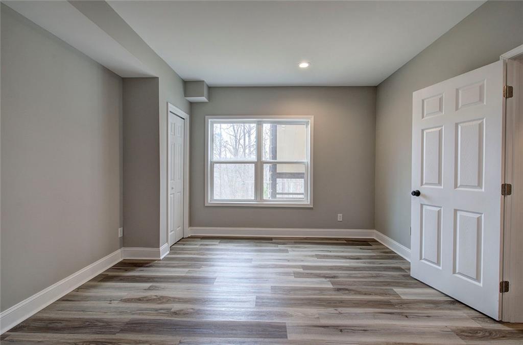 18 Weather View Trail Cartersville, GA 30121 - Photo 52 of 78 wooden floor in an empty room with a window