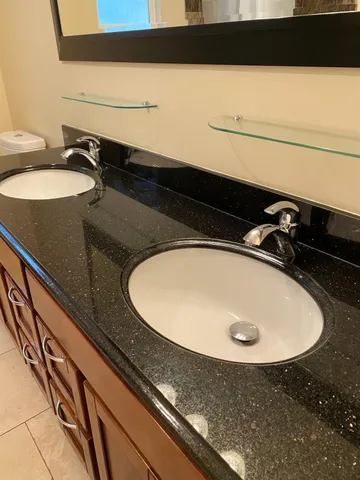 a bathroom with a sink and mirror