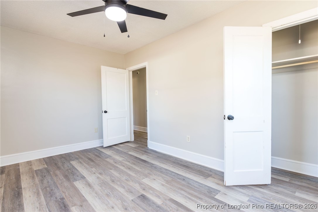 6341 Cliffdale Road Fayetteville, NC 28314 - Photo 17 of 20 a view of an empty room with wooden floor