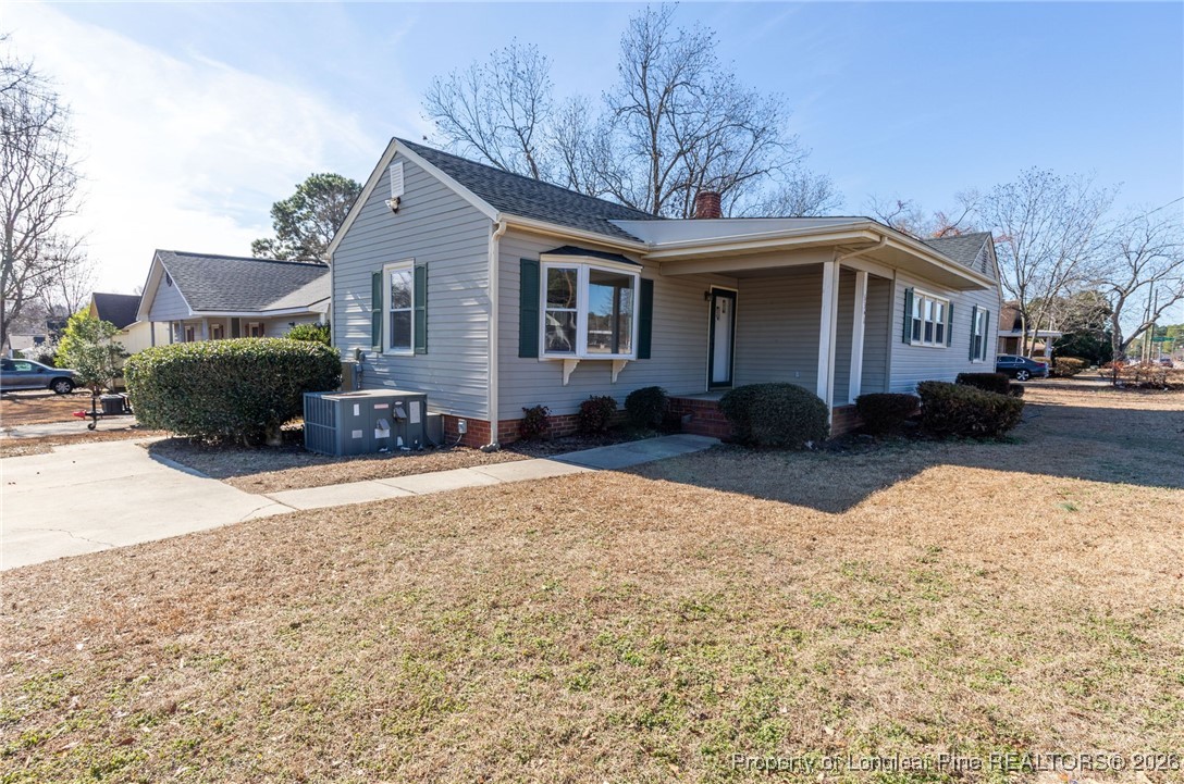6341 Cliffdale Road Fayetteville, NC 28314 - Photo 2 of 20 a front view of a house with a yard covered in snow