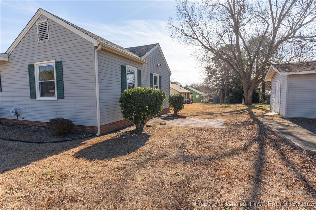 6341 Cliffdale Road Fayetteville, NC 28314 - Photo 3 of 20 a backyard of a house with table and chairs