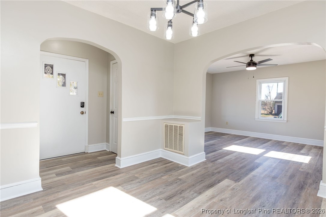 6341 Cliffdale Road Fayetteville, NC 28314 - Photo 10 of 20 wooden floor in an empty room with a window