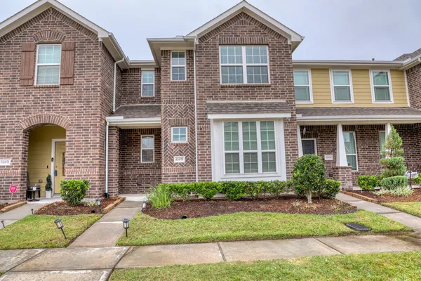 a front view of a house having yard