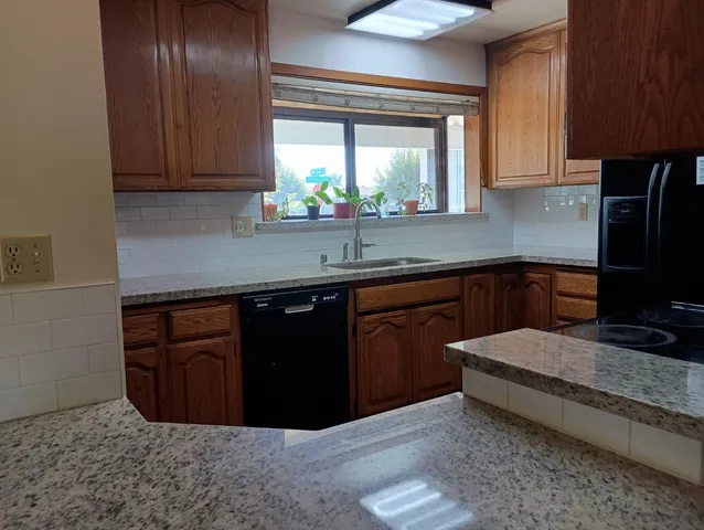 a view of an empty room and floor to ceiling window
