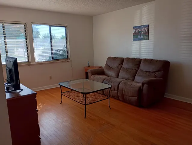 a kitchen with stainless steel appliances granite countertop wooden cabinets and a granite counter tops