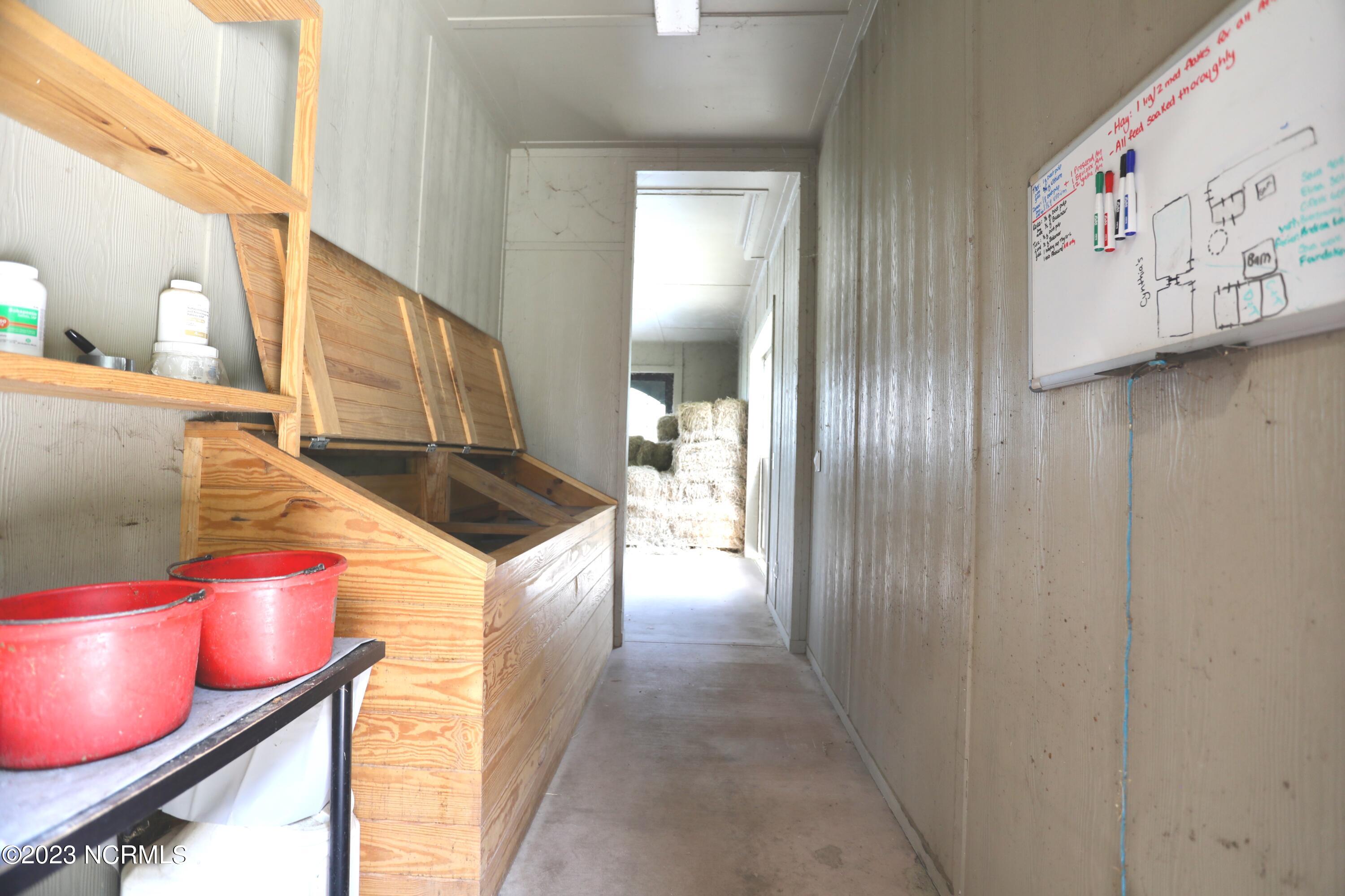 2545 Lakebay Road Vass, NC 28394 - Photo 23 of 58 Grain room which leads to hay storage