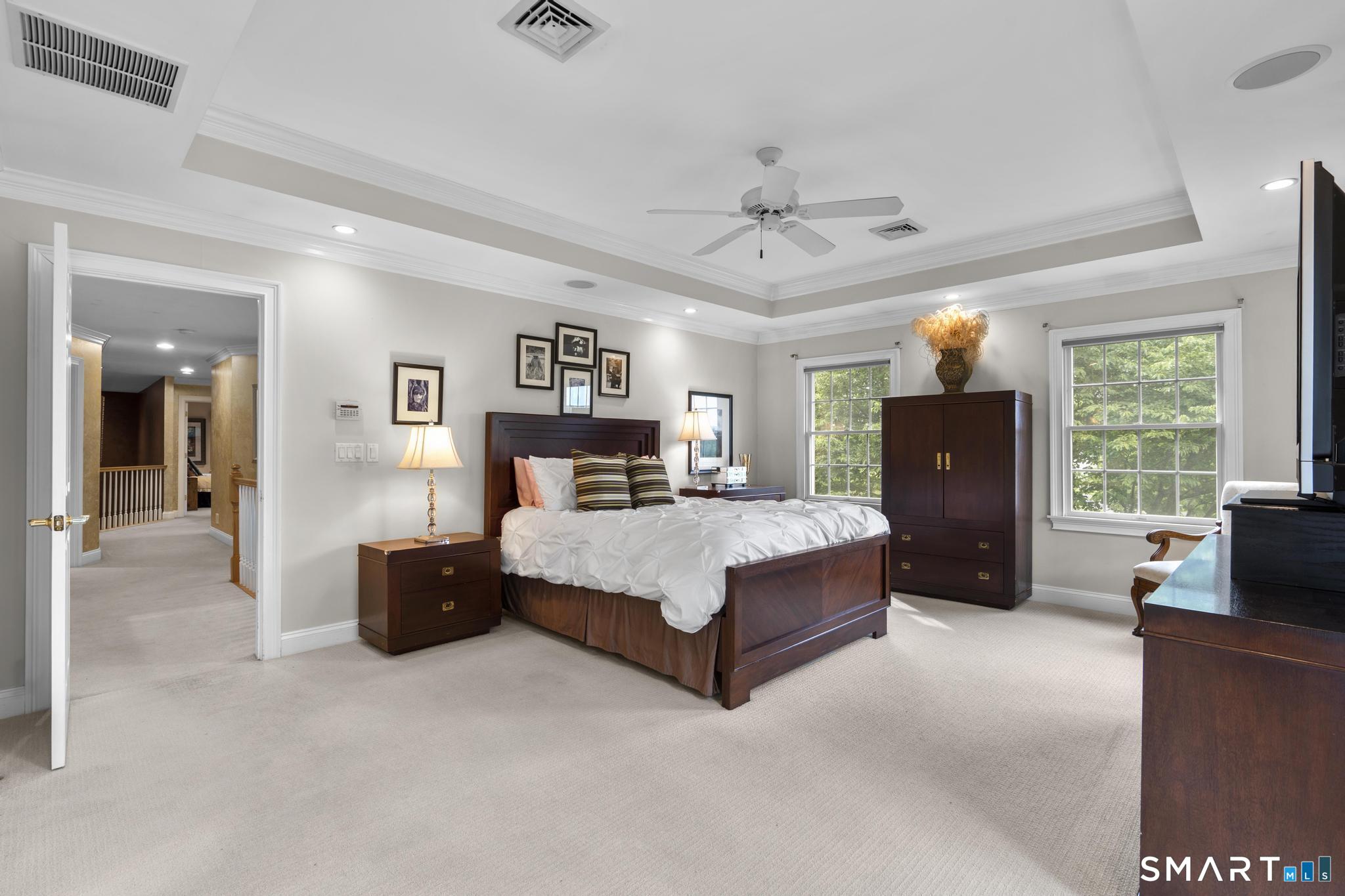 12 Logans Way Danbury, CT 06811 - Photo 20 of 40 a spacious bedroom with a bed and a couch